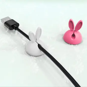 Силиконов държач за кабел с кроличьими уши за работния плот е с малък отвор, за да се учат